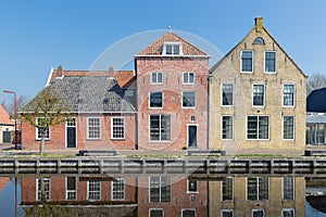 Houses along a canal in Makkum, an old Dutch village