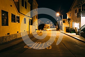 Houses along a street at night, in Newport Beach