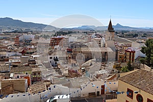 Houses around the Church of Santa Maria with the mountains in the background. Villena, Alicante, Spain