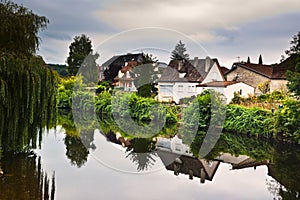 Houses on the banks of River La Cere Bretenoux France photo