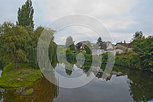 Houses on the banks of River La Cere Bretenoux France photo