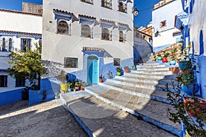 Houses in the blue town Chefchaouen with colourful flower pots