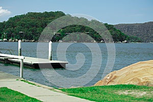 Houses and Boat Sheds amongst the trees on Hawkesbury River on Sydney Central Coast NSW Australia