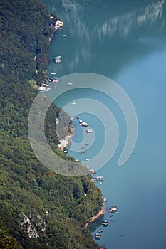 Houses and boats on Perucac lake Tara mountain photo