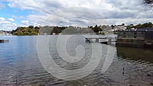 Houses, boats, wharfs, Trees and flowers on Sydney George River mouth at Tom Uglys Bridge NSW Australia.