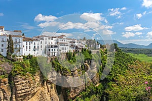 Houses built on the cliffs of beautiful Ronda city, view from Ne