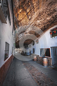 Houses built into rocks at Cuevas de la Sombra Street - Setenil de las Bodegas, Cadiz Province, Andalusia, Spain photo