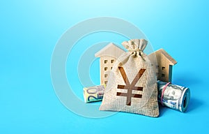 Houses and chinese yuan or japanese yen money bag. Asset, financial resource management. Building up capital, saving from