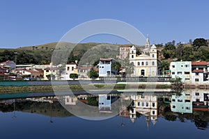 Houses and churches reflected in the blue waters photo