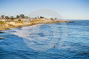 Houses close to the eroded Pacific Ocean coastline, Santa Cruz, California photo