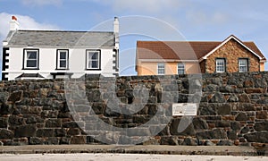 Houses on coast road at Cobo Bay on Guernsey