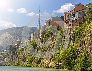 Houses on the edge of a cliff above the river Kura. Tbilisi, the historic city