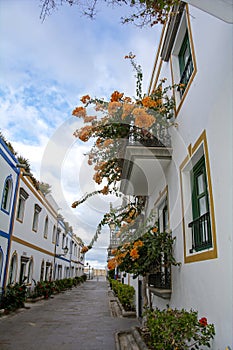 Houses with flowers in the Spanish town of Puerto de MogÃÂ¡n photo