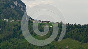 Houses on green hillside lake Lucerne