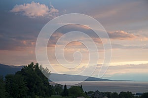 Houses and Greenery besides Lake Geneva at Sunset