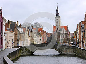 Houses and historic church alongside city canal