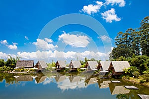 Houses in lake with blue sky in daylight