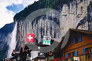 Houses in Lauterbrunnen (Switzerland) and Staubbach Falls