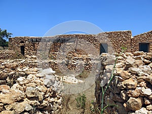 Houses made of stone in Lampedusa photo