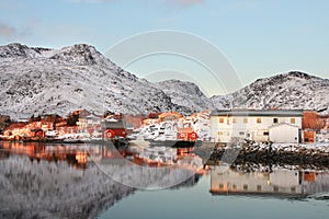 Houses mirroring in Ballstad's fjord