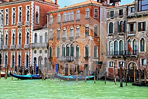 Houses with moored gondolas along Grand Canal in Venice, Italy