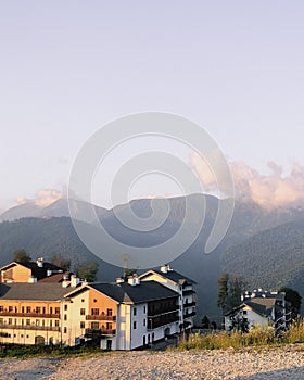 houses in the mountains at sunset