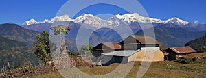 Houses near Ghale Gaun and snow capped Manaslu range