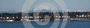 Houses near Squalicum Beach in Bellingham with Canadian Border Peaks in the background