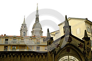 Houses in Novara with the dome of San Gaudenzio. Spiers and houses near the bell tower of the cathedral and the dome designed by