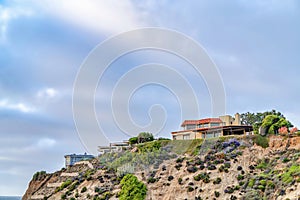 Houses with ocean front views against cloudy sky background in San Diego CA