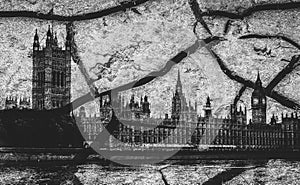 Houses of Parliament and Big Ben in London with deep cracks as a metaphor for disorder - Brexit theme