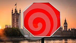 Houses of Parliament, London in background with stop sign in foreground. Insert your own message