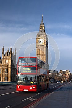 Houses of Parliament with red bus in London