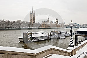 Houses of Parliament, Thames, London in the snow