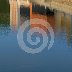 Houses are reflected in the water