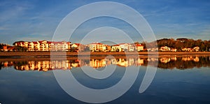 Houses reflected in the water of the beach at sunset, Hendaia