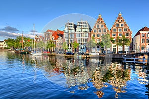 Houses reflection in Haarlem canals, Netherlands photo