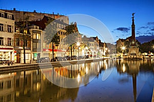 Houses reflectiong in water on the Saint Catherine square photo