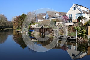 Houses and reflections in Lancaster Canal, Borwick