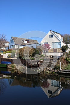 Houses and reflections in Lancaster Canal, Borwick