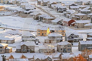 Houses and roads of a residential neighborhood in the valley on a winter setting