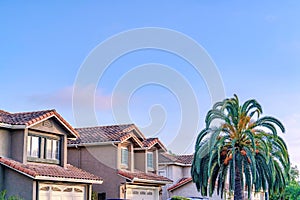 Houses in San Diego California neighborhood against blue sky on a sunny day