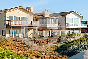 Houses that are set amid coastal sand dunes. Beautiful houses with ocean views in a small beach town