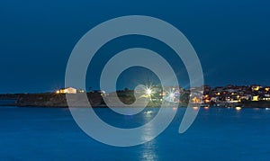 Houses on the shore during the night