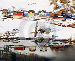 Houses on the shore of Sogne fjord in winter. Norway, Europe