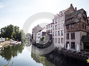 Houses and small restaurant area on a canal in Strasbourg, France
