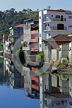 Houses of small town reflected in the blue waters photo