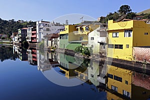 Houses of small town reflected in the blue waters photo