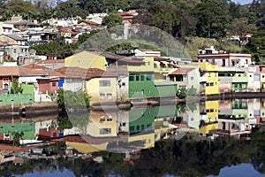 Houses of small town reflected in the blue waters photo