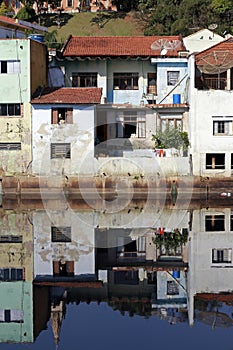 Houses of small town reflected in the blue waters photo